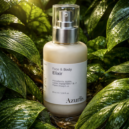 Azurlis Face &amp; Body Elixir bottle with a silver pump against a green leafy background
